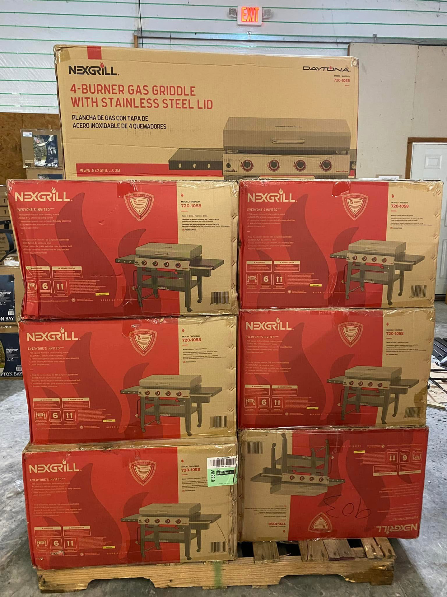 Pallet of boxed Nexgrill Daytona four-burner gas griddles with stainless steel lids